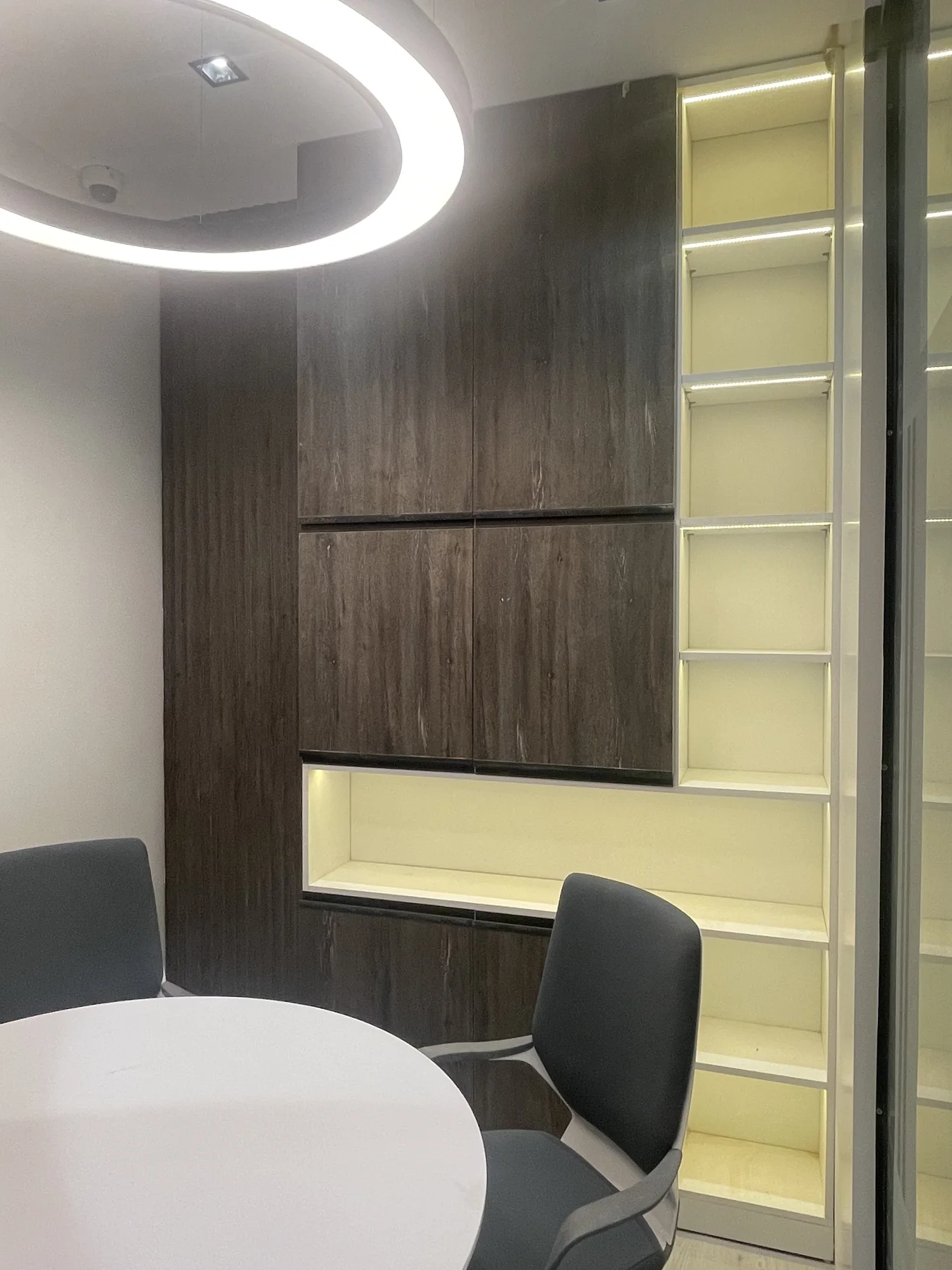 A considered CFC office interior where warm timber meets soft light.