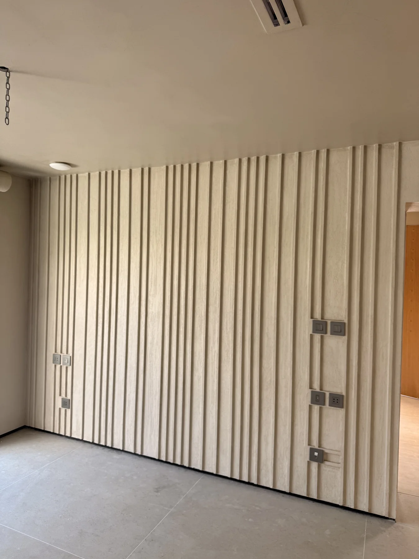 A considered interior view of timber surfaces, storage and soft natural light.