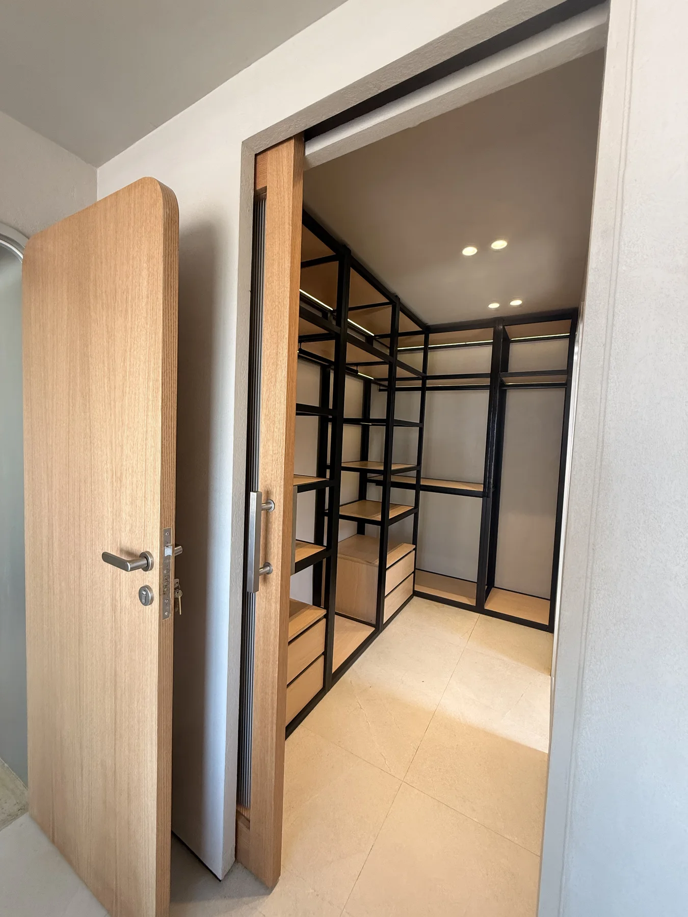 A considered interior view of timber surfaces, storage and soft natural light.
