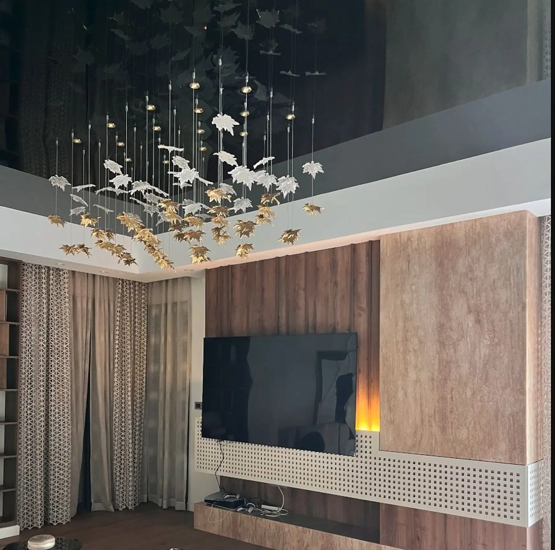 Media joinery and dark timber set a calm focal wall.