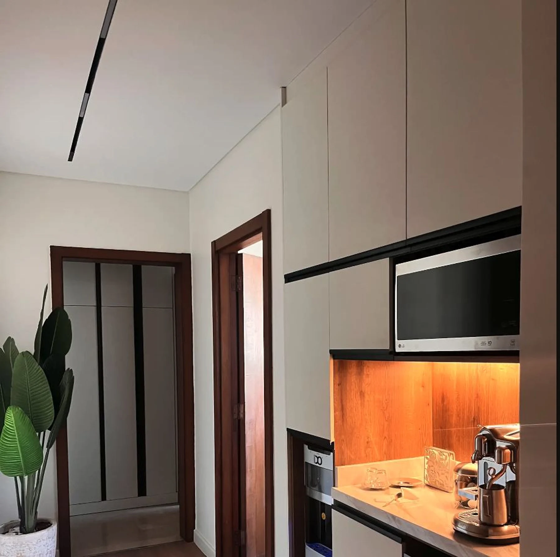 A compact kitchen and adjoining door set resolved as one residential package.