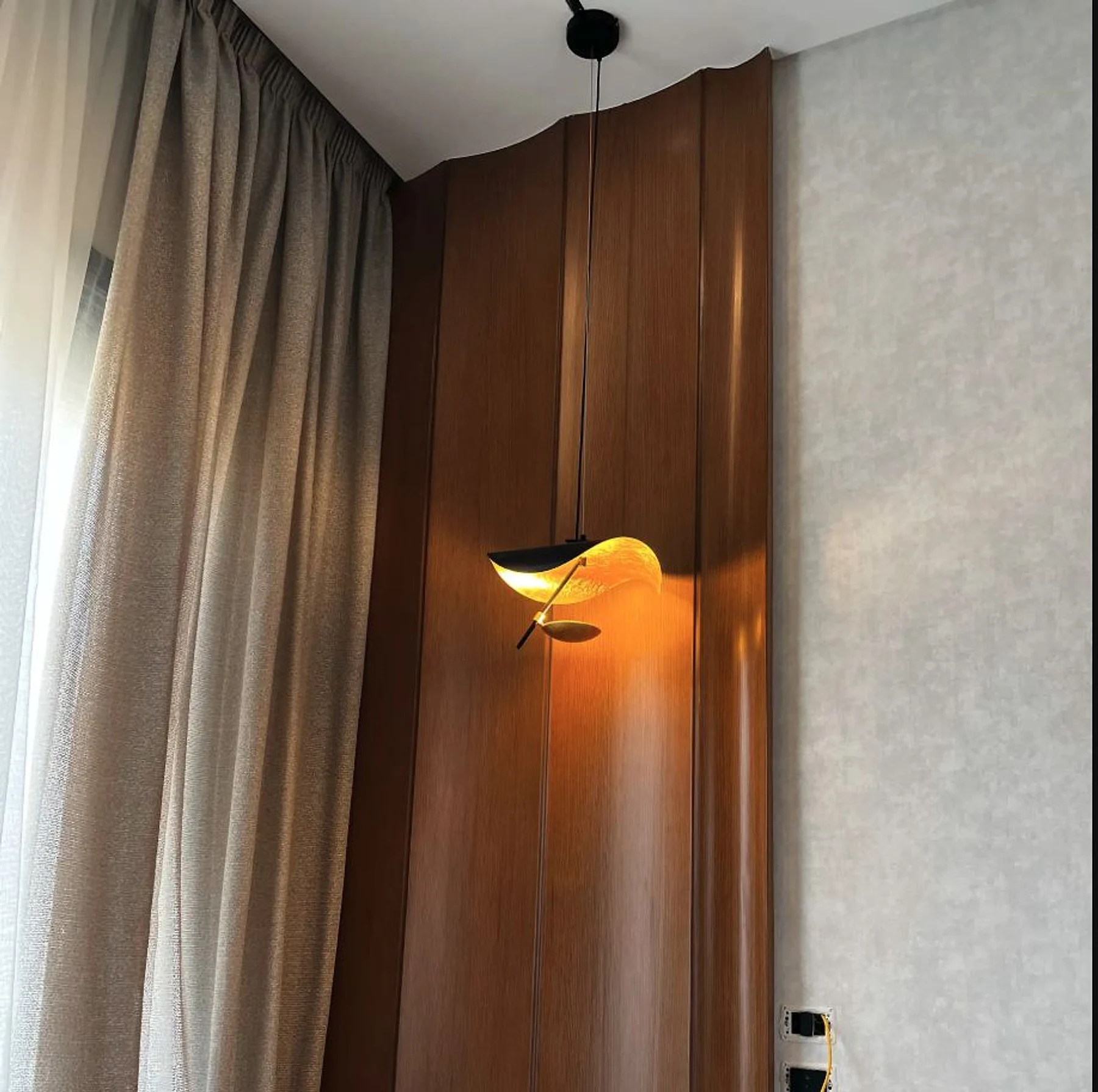 A close wall detail showing the junction between veneer, lighting and fabric.