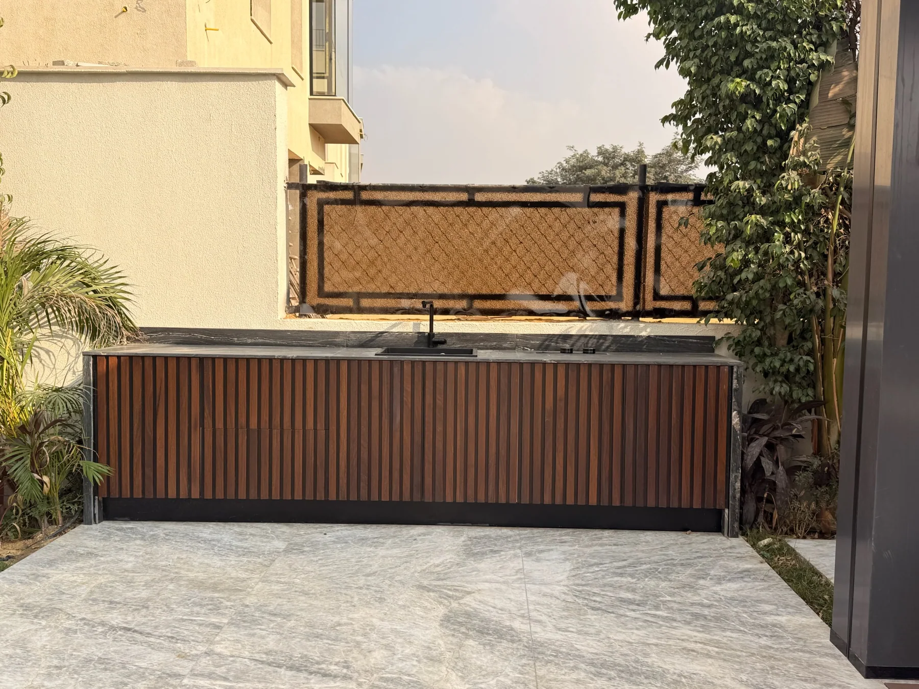 Storage, wall treatment and furniture held in one interior language.