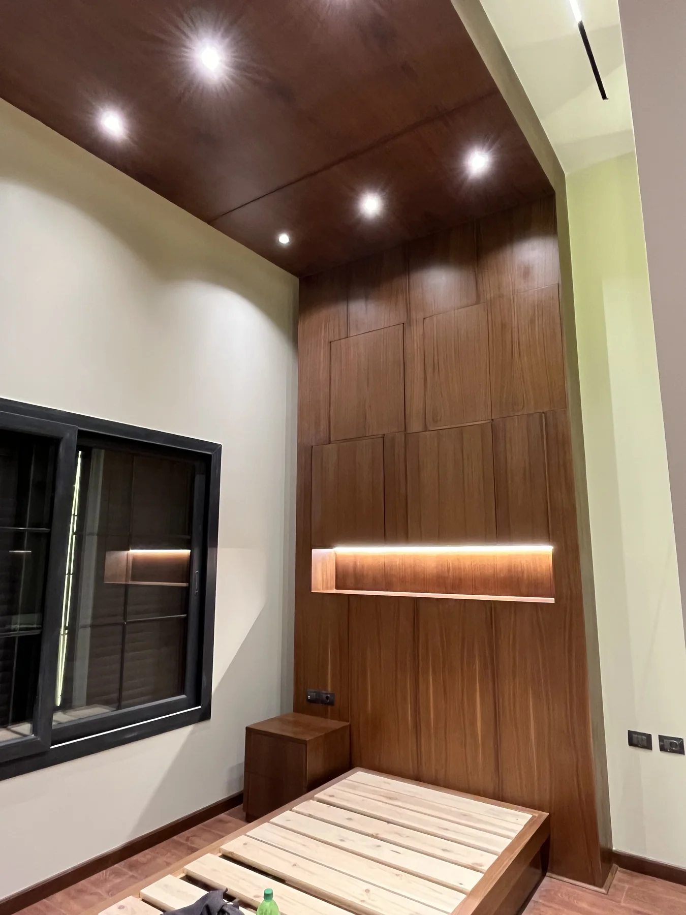 A warm living space framed by timber walls and integrated joinery.