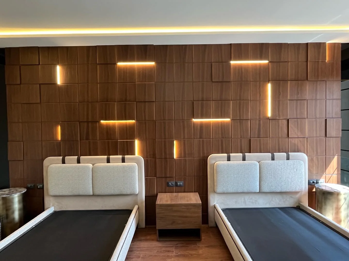 A quiet bedroom composition with crafted timber and softened light.