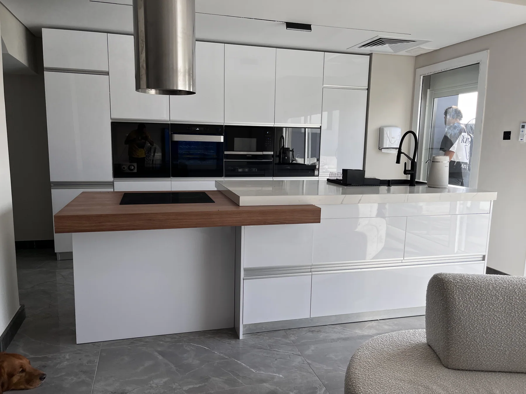 Front view of the completed white island kitchen